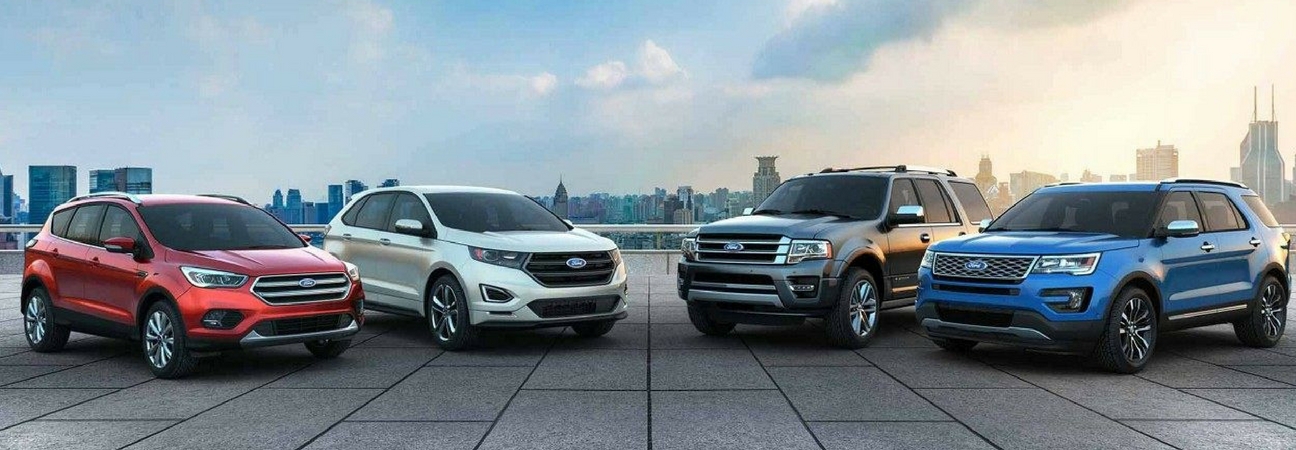 Right to left: red Ford Escape, white Ford Edge, silver Ford Expedition, blue Ford Explorer